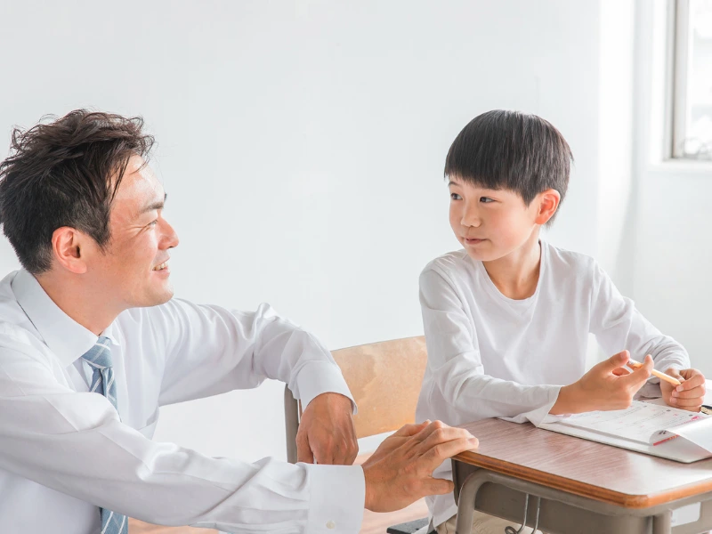 A Regent teacher supporting a student